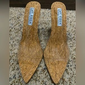 Super cute small heel, clear band stilettos.